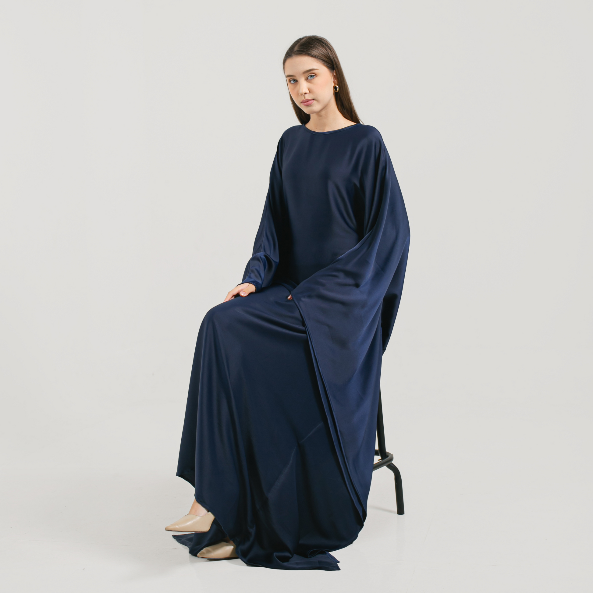 serene-luxury-eid-abaya-premium-silk-navy-blue-model-pose-sitting